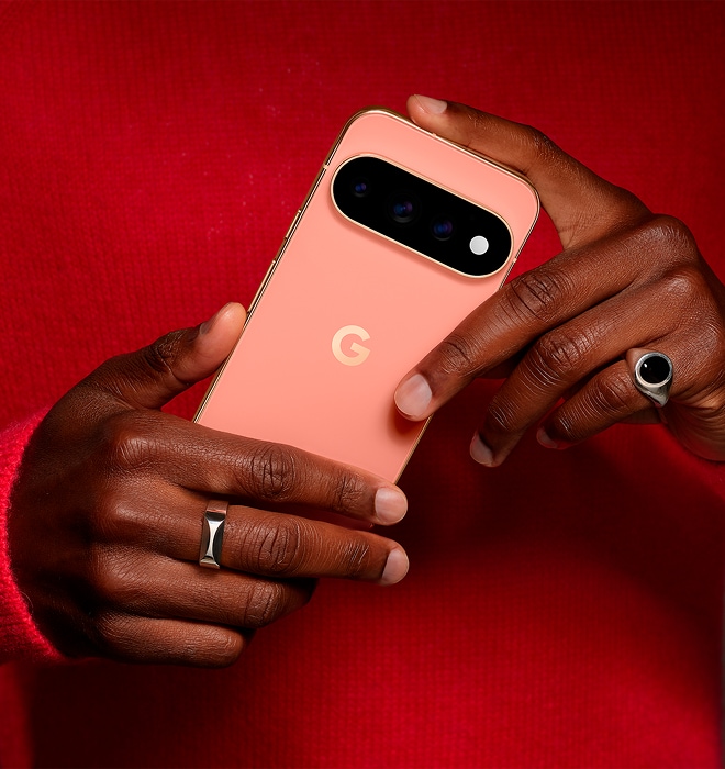 A pair of hands holding a Pixel 11 Pro