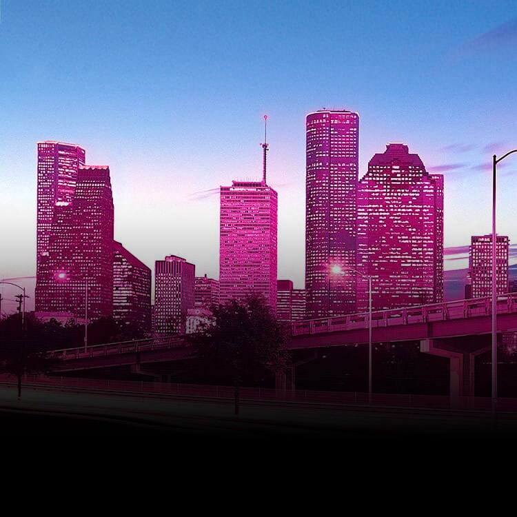 Magenta city skyline at dusk