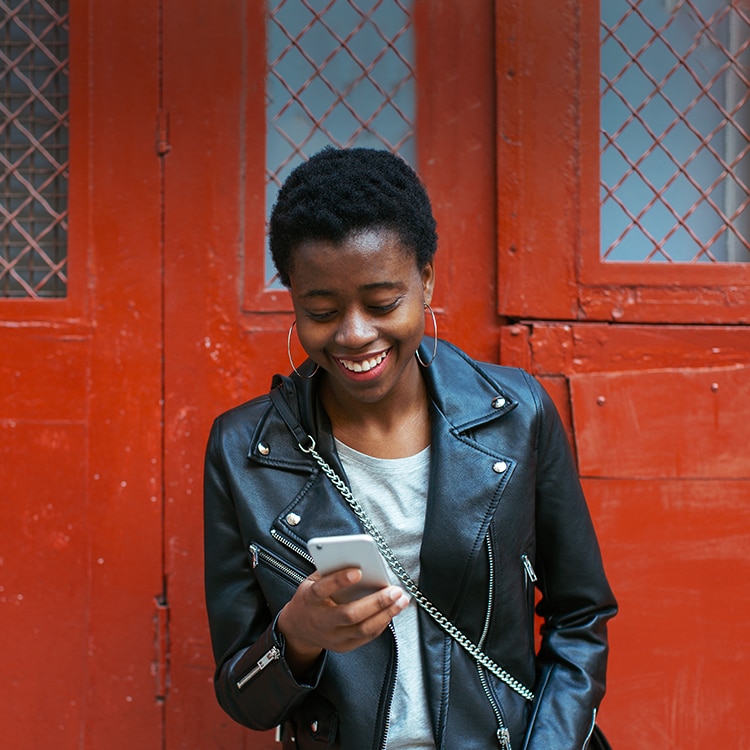 Woman smiling looking at her photo