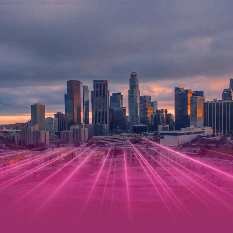 Los Angeles skyline with glowing magenta beams radiating from the city