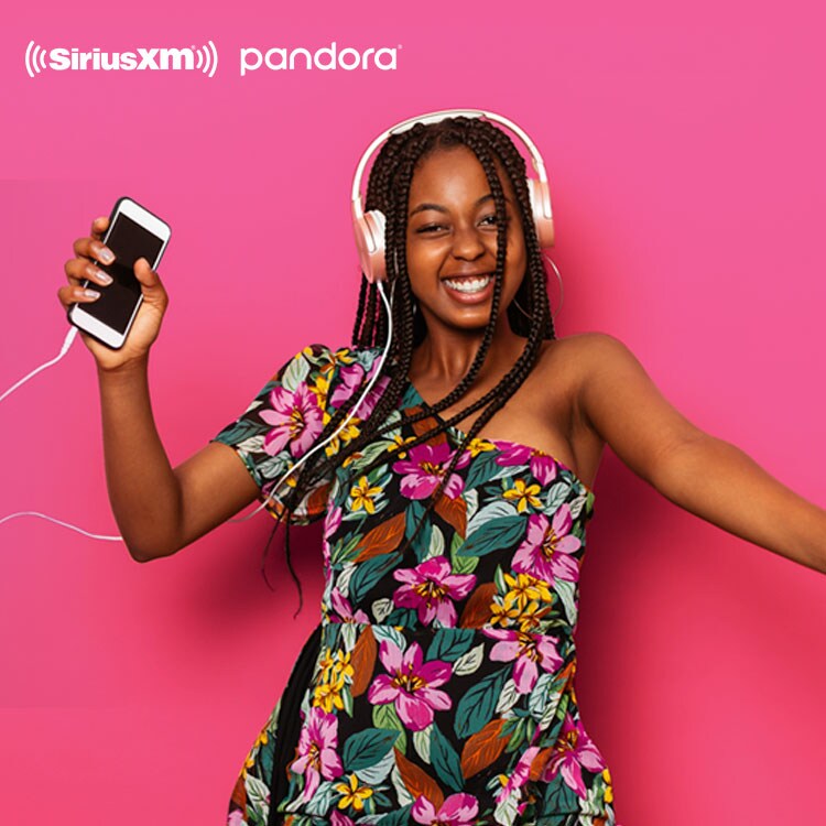 Woman dancing to music from Pandora with headphones on